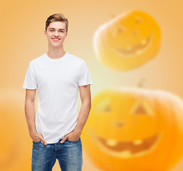 Image showing smiling young man in blank white t-shirt