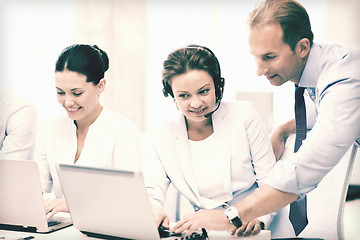 Image showing group of people working in call center