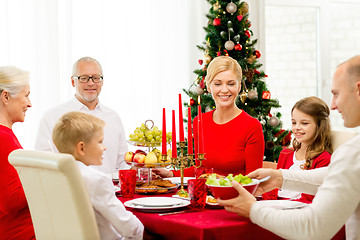 Image showing smiling family having holiday dinner at home