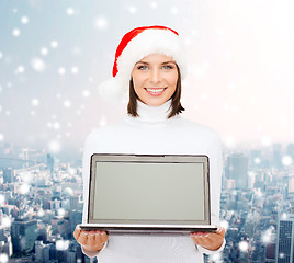 Image showing woman in santa helper hat with laptop computer