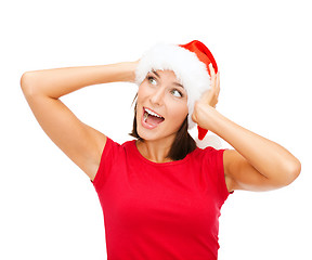 Image showing surprised woman in santa helper hat