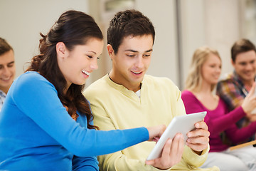 Image showing group of smiling students with tablet pc