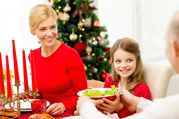 Image showing smiling family having holiday dinner at home