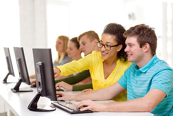 Image showing smiling students in computer class at school