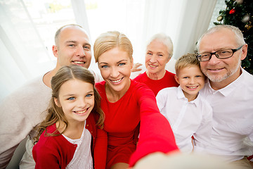 Image showing smiling family making selfie at home