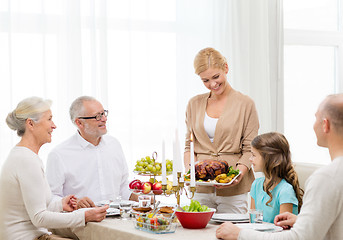 Image showing smiling family having holiday dinner at home