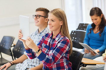 Image showing group of smiling students with tablet pc