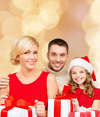 Image showing happy family with gift boxes