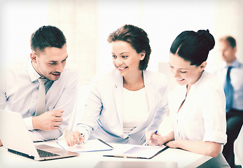 Image showing business team discussing something in office