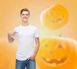 Image showing smiling young man in blank white t-shirt