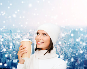 Image showing smiling young woman in winter clothes with cup