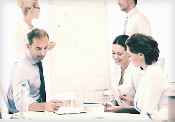 Image showing business team discussing something in office