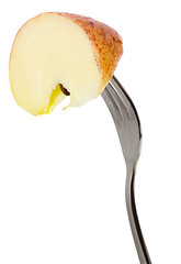 Image showing Apple held by a fork

