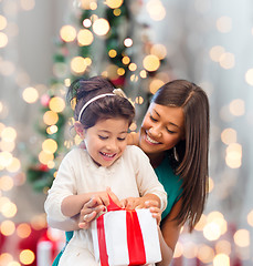 Image showing happy mother and little girl with gift box