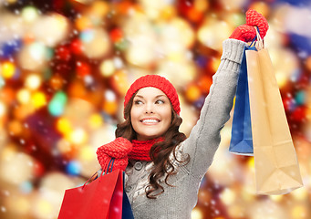 Image showing asian woman in winter clothes with shopping bags