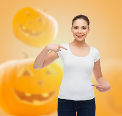 Image showing smiling young woman in blank white t-shirt