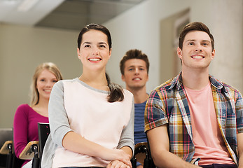 Image showing group of smiling students in lecture hall