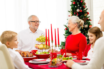 Image showing smiling family having holiday dinner at home