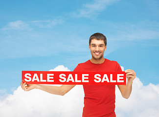 Image showing man in red t-shirt with sale sign