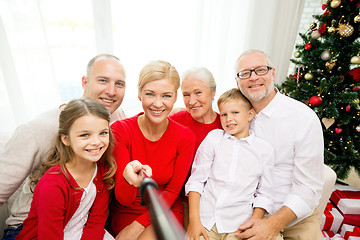 Image showing smiling family making selfie at home