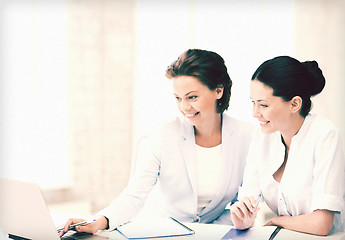 Image showing businesswomen working with laptop in office