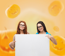 Image showing smiling teenage girls with white board