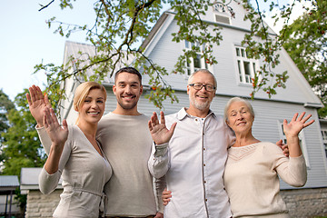 Image showing happy family in front of house outdoors