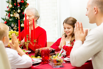 Image showing smiling family having holiday dinner at home