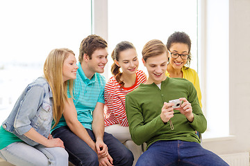 Image showing smiling students with digital camera at school