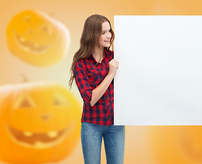 Image showing smiling teenage girl with white board