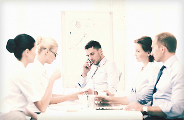 Image showing stressed male boss on business meeting