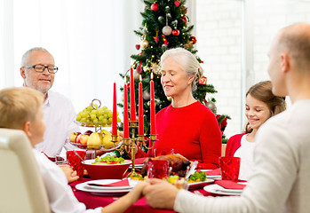 Image showing smiling family having holiday dinner at home