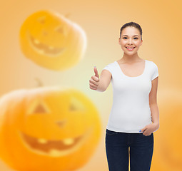 Image showing smiling young woman in blank white t-shirt