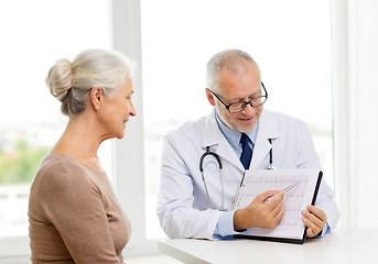 Image showing smiling senior woman and doctor meeting