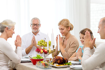 Image showing smiling family having holiday dinner at home