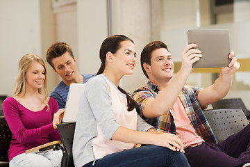 Image showing group of smiling students with tablet pc