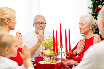 Image showing smiling family having holiday dinner at home