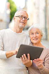 Image showing senior couple photographing on city street