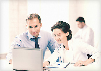 Image showing man and woman working with laptop in office