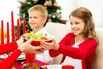 Image showing smiling family having holiday dinner at home