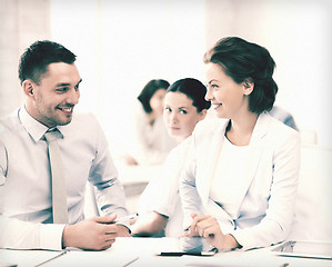 Image showing usiness colleagues talking in office