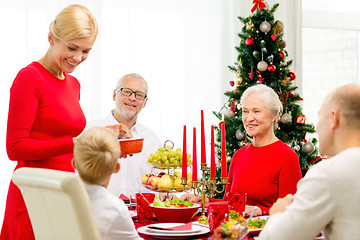 Image showing smiling family having holiday dinner at home