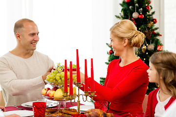 Image showing smiling family having holiday dinner at home