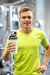 Image showing smiling man with protein shake bottle