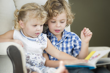 Image showing Young Brother and Sister Reading a Book Together