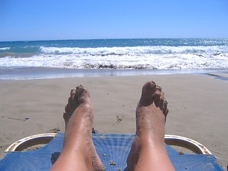 Image showing Dirty feet on a shore