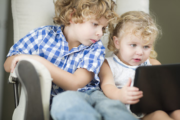 Image showing Young Brother and Sister Using Their Computer Laptop Together