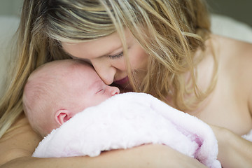 Image showing Young Beautiful Mother Holding Her Precious Newborn Baby Girl