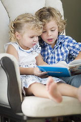 Image showing Young Brother and Sister Reading a Book Together