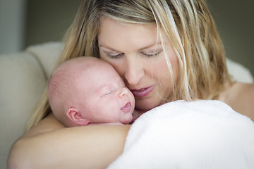 Image showing Young Beautiful Mother Holding Her Precious Newborn Baby Girl